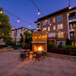 a fire pit on a patio at night